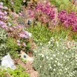 What landscaping ideas can enhance a sloping site?